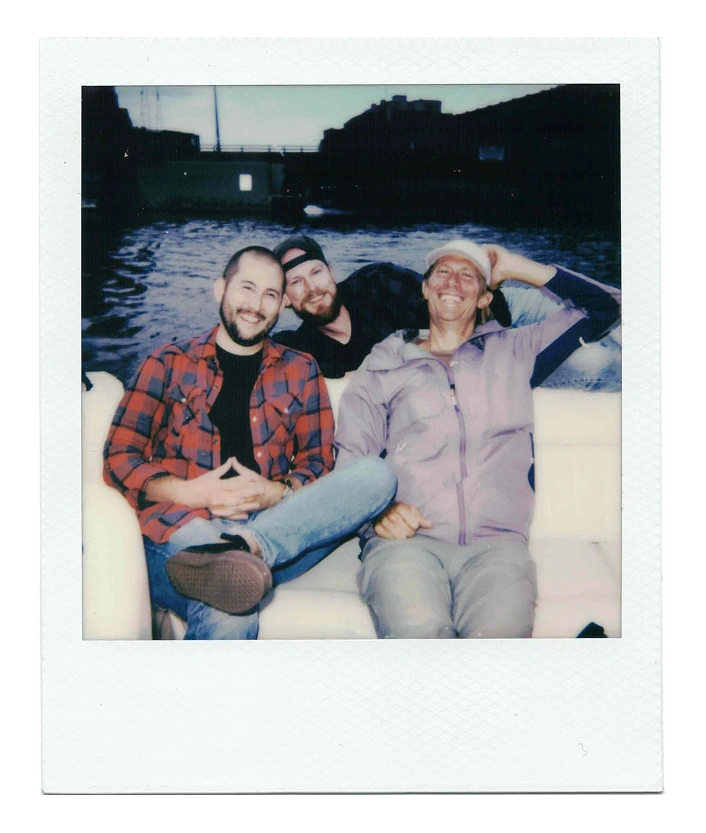 Poloroid of some of the Ocupop crew, on a boat.